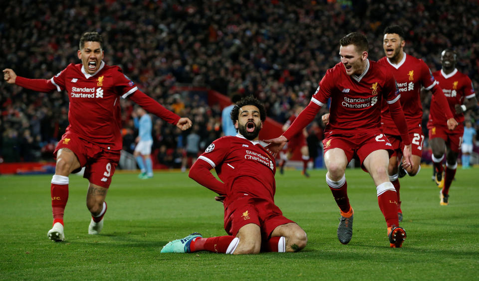 <p>Soccer Football – Champions League Quarter Final First Leg – Liverpool vs Manchester City – Anfield, Liverpool, Britain – April 4, 2018 Liverpool’s Mohamed Salah celebrates with Roberto Firmino and Andrew Robertson after scoring their first goal REUTERS/Andrew Yates </p>