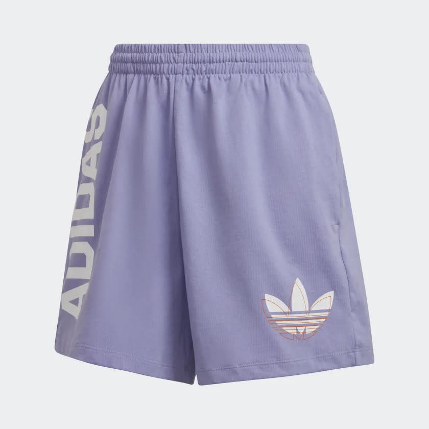 Purple shorts with Adidas logo and script in large white letters