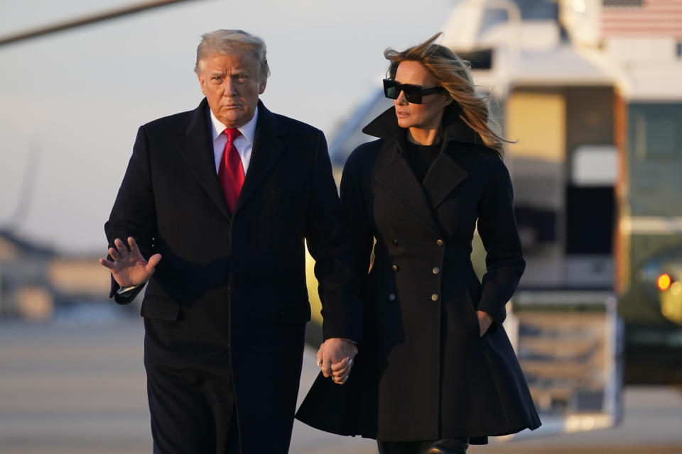 President Donald Trump and first lady Melania Trump board Air Force One at Andrews Air Force Base, Md., Wednesday, Dec. 23, 2020. Trump is traveling to his Mar-a-Lago resort in Palm Beach, Fla. (AP Photo/Patrick Semansky)