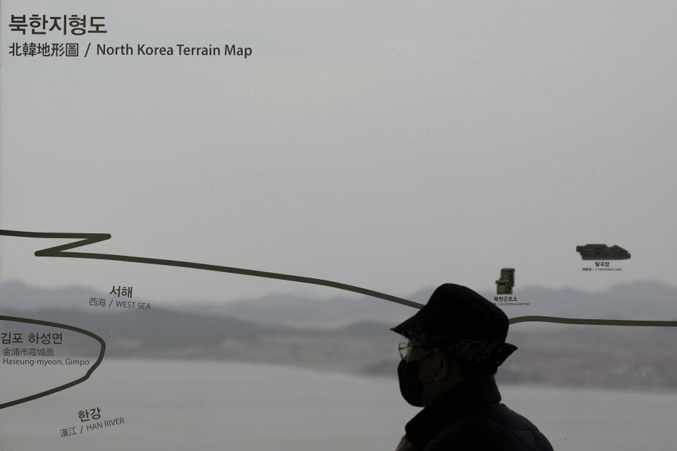 A visitor looks at the North Korean side from the unification observatory in Paju, South Korea, Tuesday, March 14, 2023. South Korea's military said Monday, March 27, 2023, it detected North Korea firing at least one ballistic missile toward the sea off its eastern coast, adding to a recent flurry in weapons tests as the United States steps up its military exercises with the South to counter the North's growing threat. (AP Photo/Lee Jin-man)