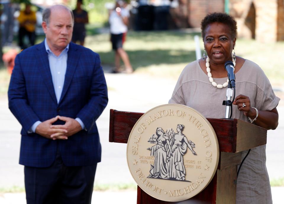 Detroit Mayor Mike Duggan listens as Detroit City Council member Mary Waters talks during a press conference on Tyler Street in Detroit on Thursday, July 21, 2022.Duggan and council members talked about a $203 million affordable housing plan to address housing insecurities in the city.