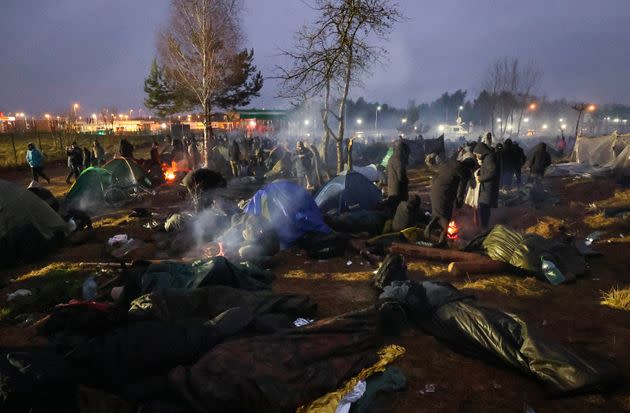 Migrants from the Middle East and elsewhere gather at the checkpoint 