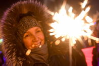 <p>People light sparklers during New Year celebrations in central Novosibirsk on December 31, 2017. (Photo: Kirill Kukhmar/Getty Images) </p>