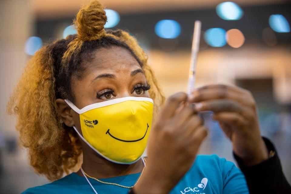 Medical assistant Keona Shepard prepares a dose of the Johnson & Johnson COVID-19 vaccine on March 4 at a mass vaccination clinic at the New Orleans Ernest N. Morial Convention Center.