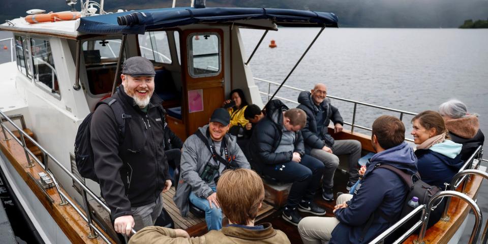 Loch Ness watcher Alan McKenna is farthest left on this image of multiple people in a small boat on Loch Ness, August 27, 2023 in Drumnadrochit Scotland