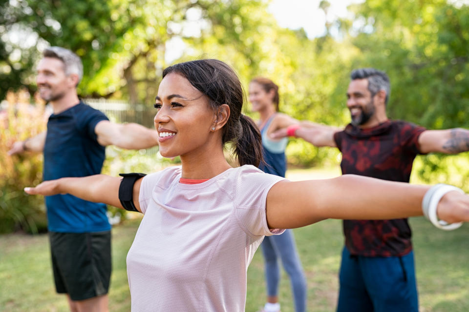 Men and women doing exercise. (Getty Images)