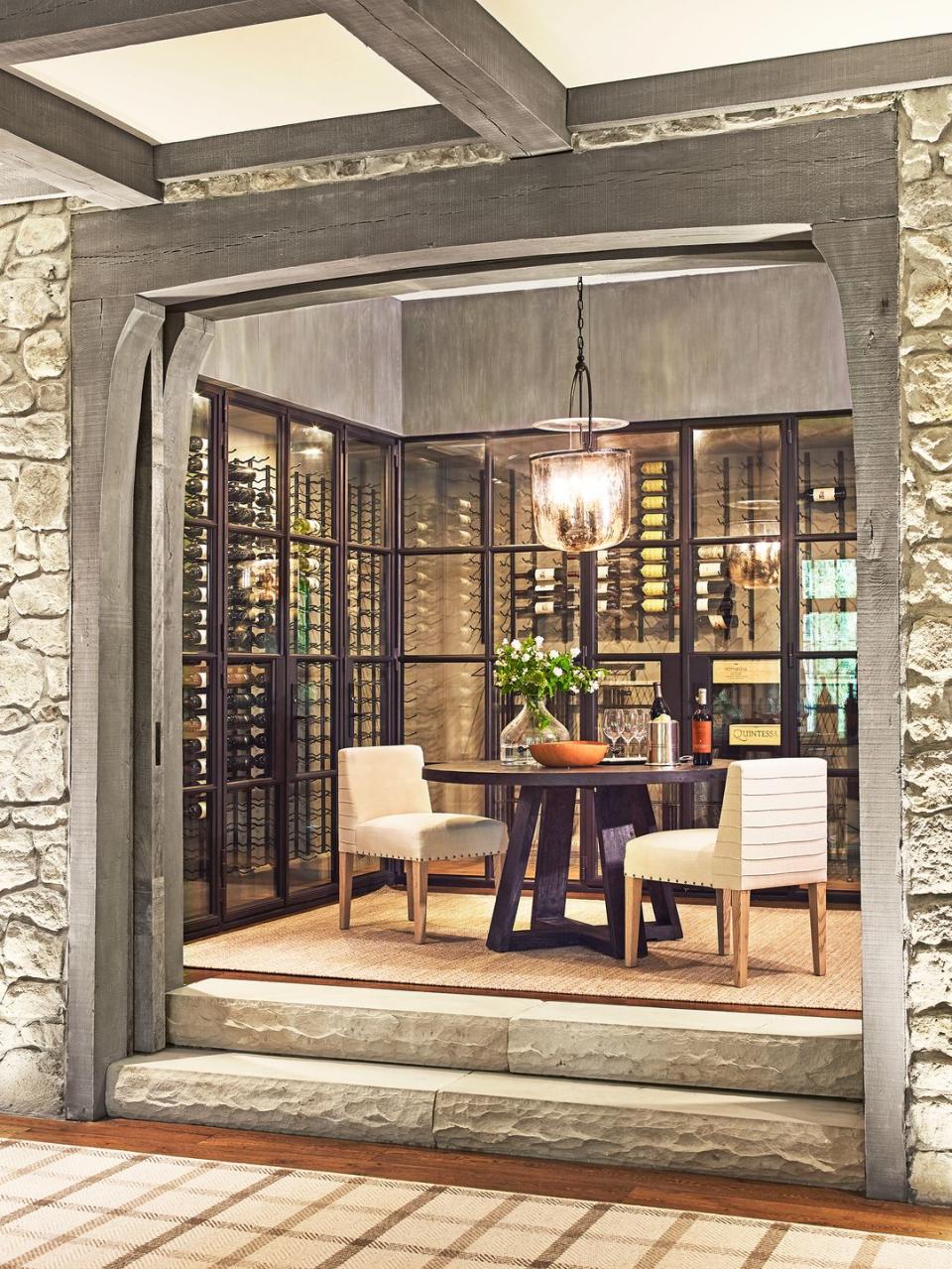 <p>When designing a wine cellar you can also host guests in, it's best to keep wine behind glass in a climate-controlled zone and then use the rest of the useable space for a lounge area so you can keep both your wine and your guests comfy. Interior designer <a href="http://suzannekasler.com/" rel="nofollow noopener" target="_blank" data-ylk="slk:Suzanne Kasler;elm:context_link;itc:0;sec:content-canvas" class="link ">Suzanne Kasler</a> designed this wine room for<a href="https://www.housebeautiful.com/design-inspiration/a33538767/suzanne-kasler-tennessee-blackberry-farm/" rel="nofollow noopener" target="_blank" data-ylk="slk:clients who love hosting;elm:context_link;itc:0;sec:content-canvas" class="link "> clients who love hosting</a> (read: wining and dining) their large extended family. </p>