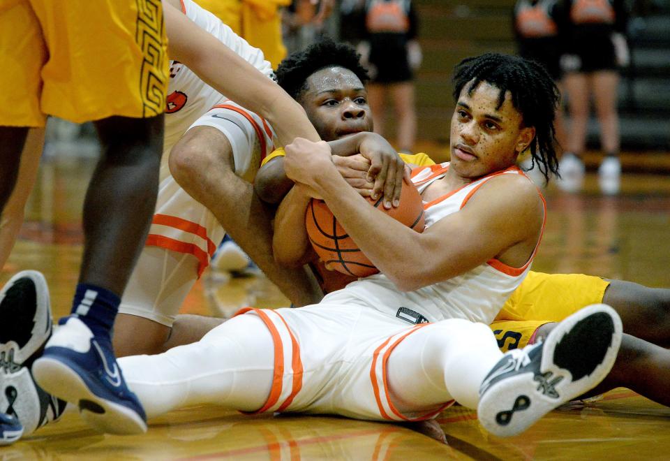 Lanphier's Jessie Bates III, right, fights for the ball with Southeast High Schools Chandler Clayton during the game Tuesday Dec. 6, 2022.