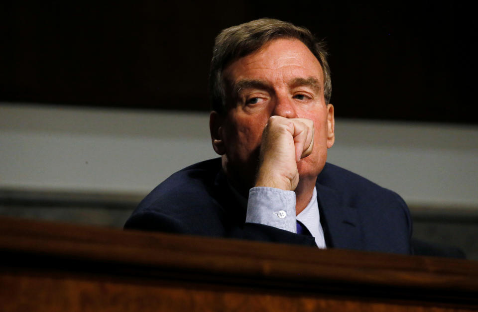 Senate Intelligence Committee Vice Chairman Senator Mark Warner listens to testimony from Twitter CEO Jack Dorsey and Facebook COO Sheryl Sandberg at a hearing on foreign influence operations on social media platforms on Capitol Hill in Washington, U.S., September 5, 2018. REUTERS/Jim Bourg