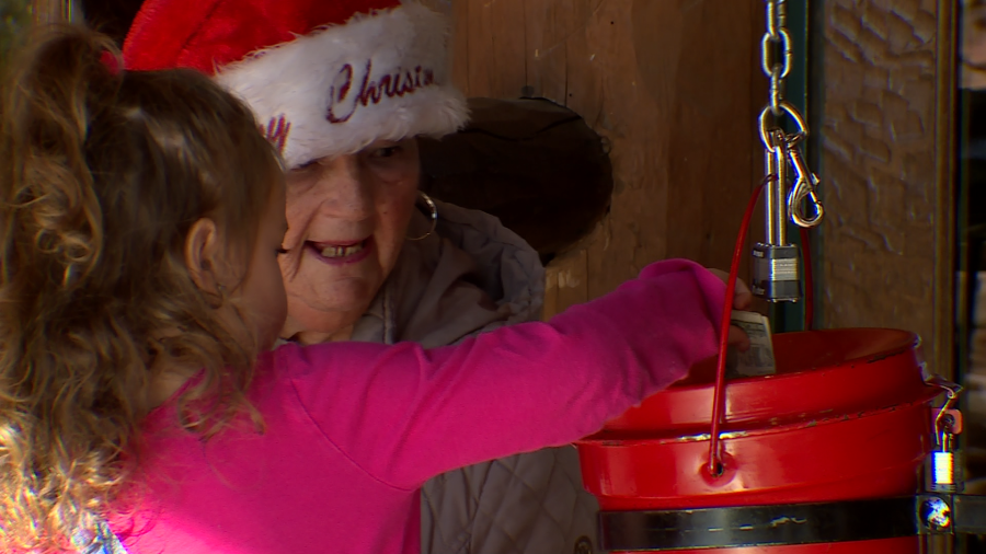 Red Kettle Campaign bell ringer Anita Murray accepts a donation outside the Las Vegas Bass Pro Shop Thursday morning. (KLAS)