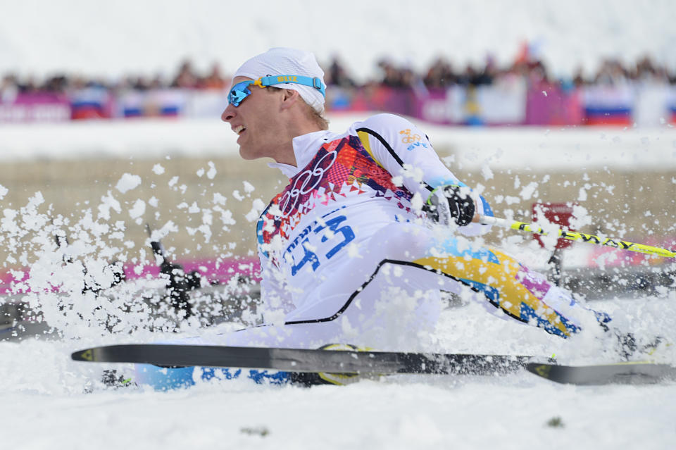 Bronze medalist Sweden's Daniel Richardsson crosses the finish line in the Men's Cross-Country Skiing 15km Classic at the Laura Cross-Country Ski and Biathlon Center during the Sochi Winter Olympics on February 14, 2014 in Rosa Khutor near Sochi.  