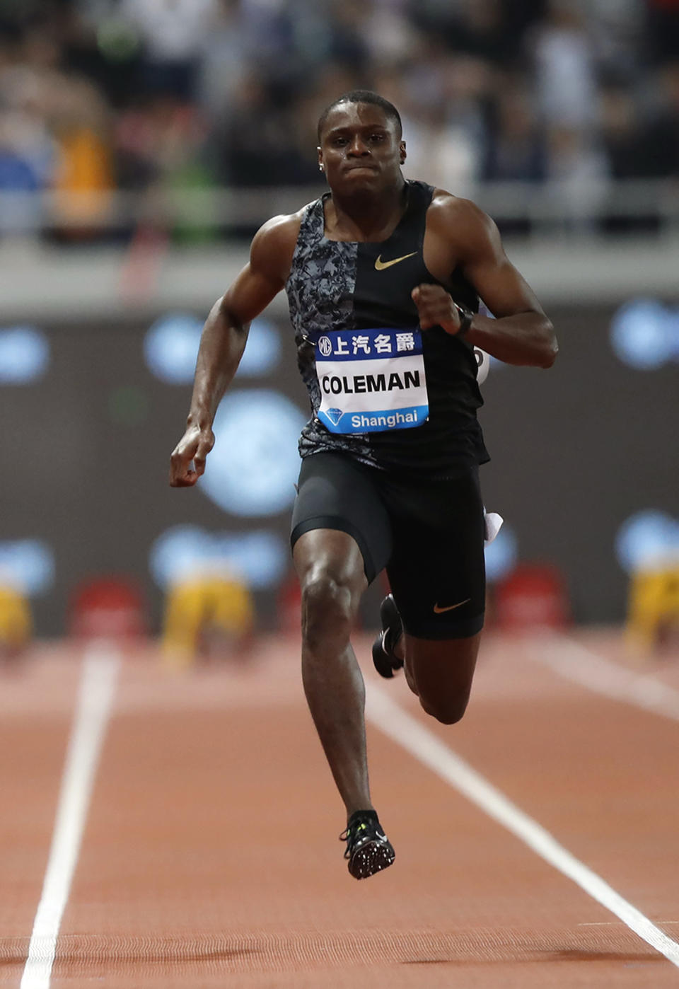 FILE - In this May 18, 2019, file photo, Christian Coleman of the United States competes in the final of the men's 100-meter event during the Diamond League Track and Field meet in Shanghai, China. The world’s fastest man now that Usain Bolt is on the sideline is 100-meter runner Christian Coleman, who almost was forced to miss world championships because he had missed too many drug tests. He got a reprieve, but, as always, the specter of doping lingers over the sport’s biggest event. (AP Photo/File)