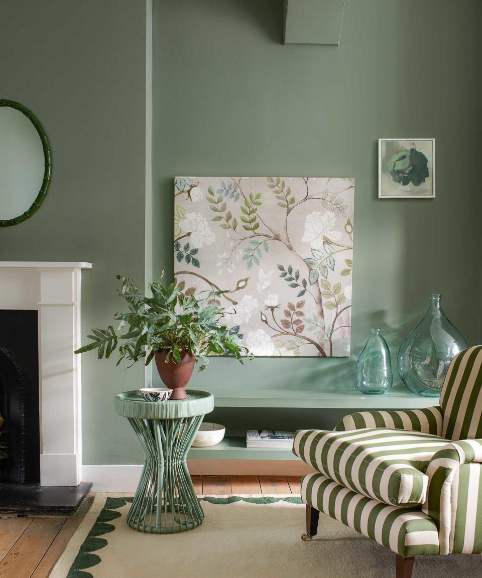 living room with armchair and fireplace