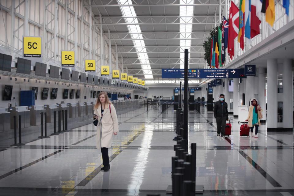 Chicago O'Hare Airport's international terminal is nearly devoid of travelers March 12, 2020, one day after President Donald Trump announced a 30-day travel ban for European travelers coming into the U.S. The move was an attempt to stem the proliferation of the COVID-19 pandemic.