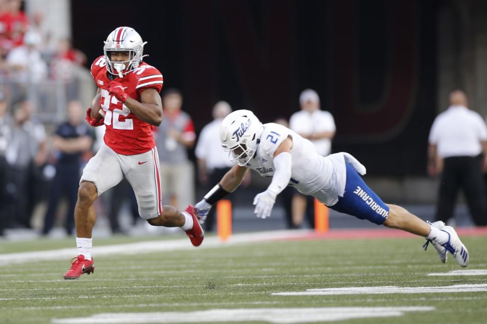 Ohio State running back TreVeyon Henderson breaks away against Tulsa on Sept. 18, 2021.