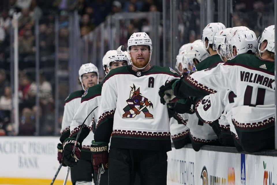 Arizona Coyotes left wing Lawson Crouse is congratulated for his goal against the Anaheim Ducks during the first period of an NHL hockey game Wednesday, Nov. 1, 2023, in Anaheim, Calif. (AP Photo/Ryan Sun)