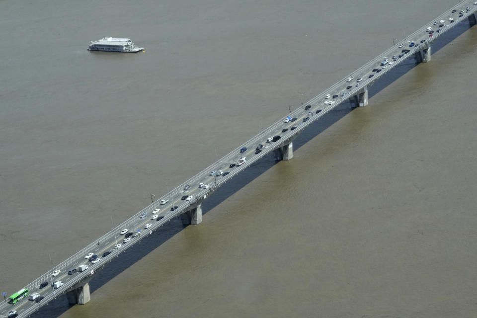 The Han River, swollen with floodwater, flows under a bridge in Seoul, South Korea, Tuesday, Sept. 6, 2022. The most powerful typhoon to hit South Korea in years battered its southern region Tuesday, dumping a meter (3 feet) of rain, destroying roads and felling power lines, leaving 66,000 homes without electricity as thousands of people fled to safer ground. (AP Photo/Ahn Young-joon)