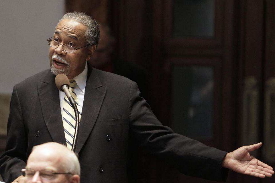 FILE-In this Friday, Jan. 7, 2011 file photo, Sen. Gerald Neal, D-Louisville, makes a point while discussing a bill during the legislative session in Frankfort, Ky. At age 74 with diabetes and high-blood pressure, Neal was at high risk of developing life-threatening problems were he to contact the virus that causes the COVID-19 disease.(AP Photo/Ed Reinke, File)