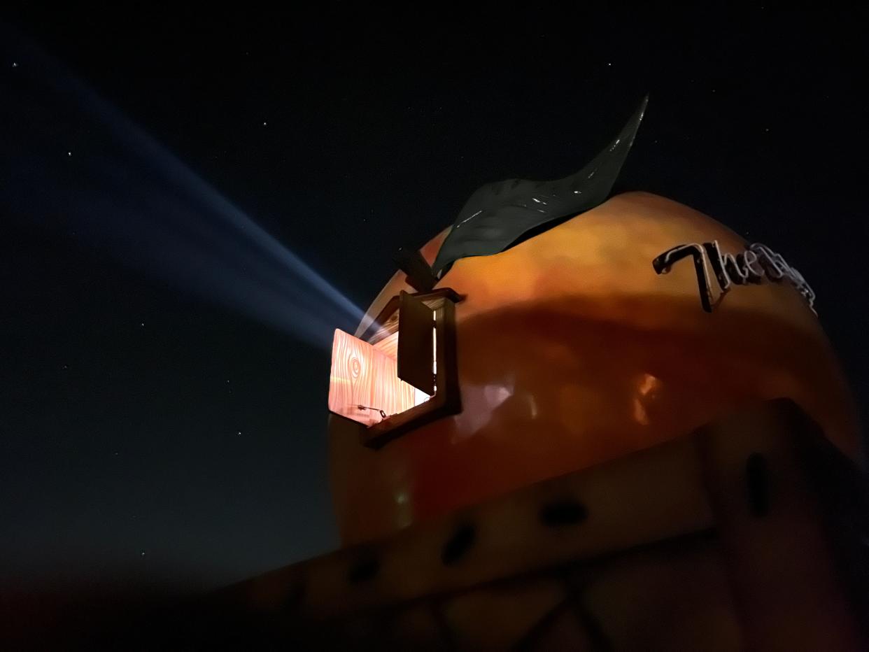 A peach-shaped projector house screens a movie at the Monetta Drive-In Theatre, also known as "The Big Mo," in Monetta, S.C. on Friday, March 29, 2024.