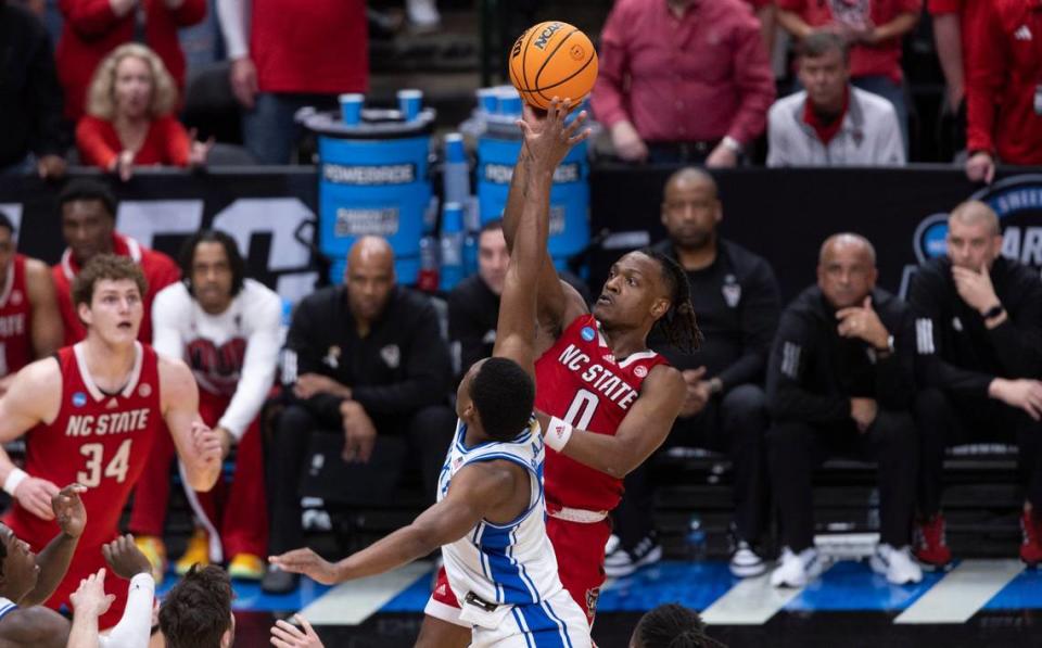 N.C. State’s D.J. Horne (0) shoots over Duke’s Jaylen Blakes (2) in the second half during the NCAA South Regional final on Sunday, March 31, 2024 at the American Airlines Center in Dallas, Texas.
