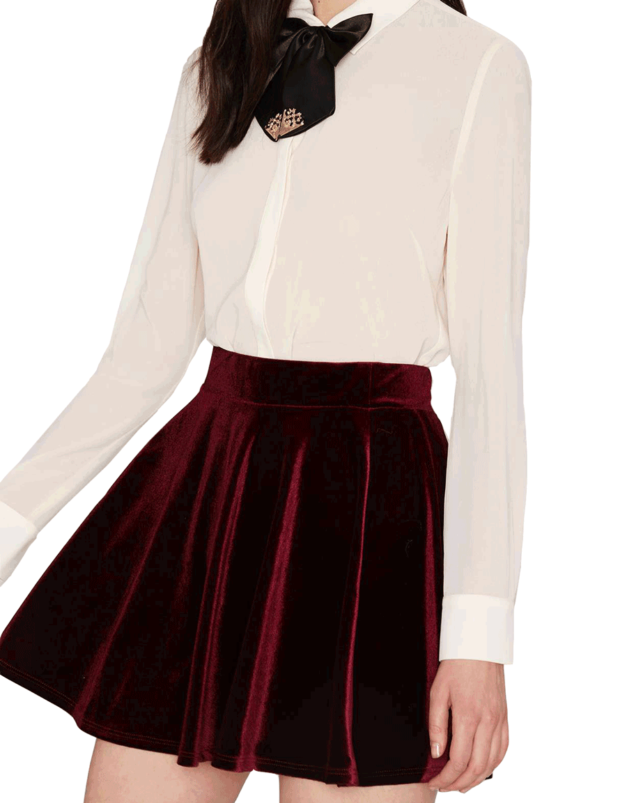 A deep red velvet skirt was made for twirling on the dance floor.