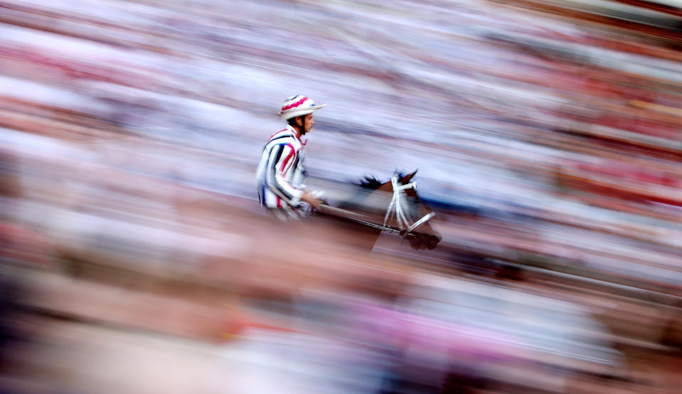 Jockey Elias Mannucci rides his horse during practice