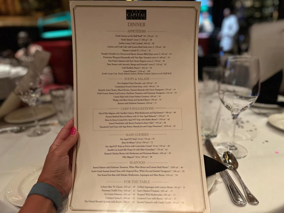 Capital Grille menu in woman's hand 