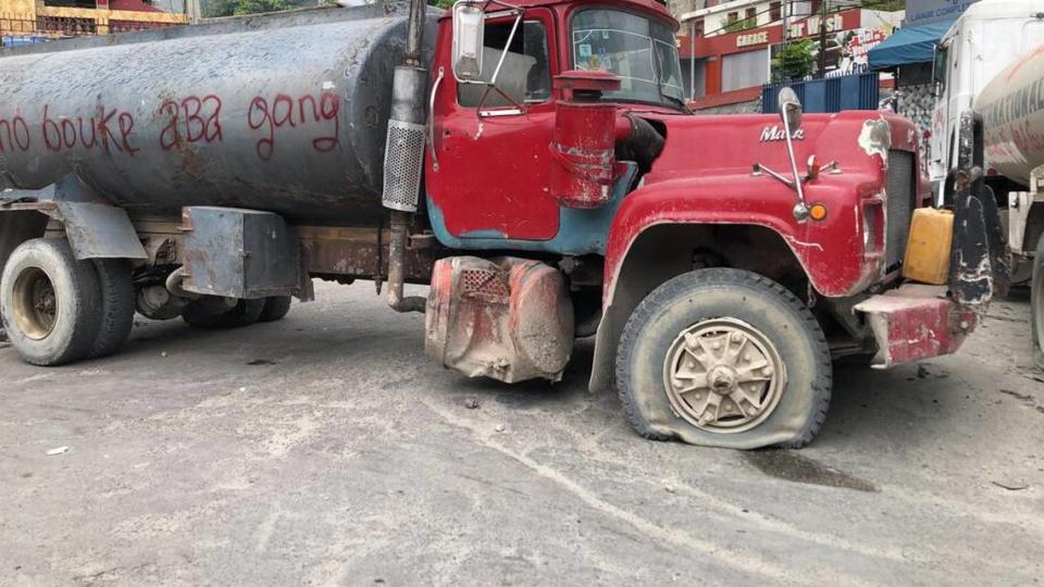 After an angry crowd in a Port-au-Prince neighborhood killed 13 suspected gang members on Monday, April 24, residents in the capital began erecting barricades to protect themselves from encroaching, menacing gangs. Here residents have scribbled, “We are fed up with gangs.”