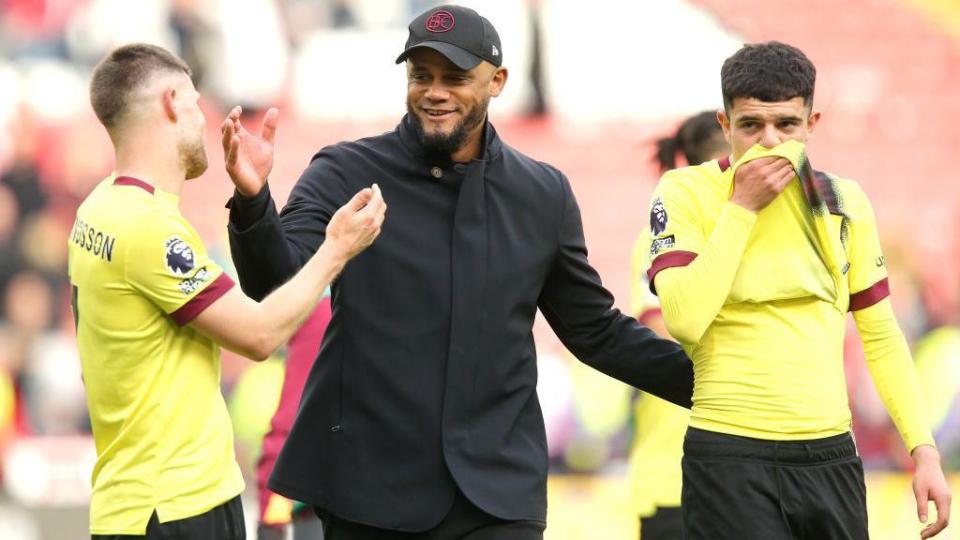 Vincent Kompany celebrates the win at the final whistle with Johann Gudmundsson and Zeki Amdouni