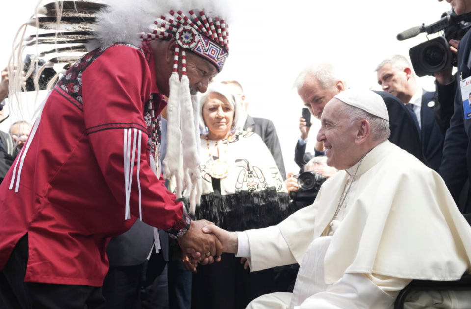 Pope Francis is greeted by George Arcand, grand chief of the Confederacy of Treaty Six First Nations, as he arrives in Edmonton, Alberta, Canada, a visit aimed at reconciliation with Indigenous people for the Catholic Church's role in residential schools.