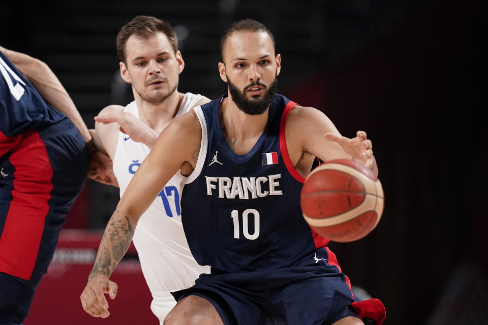 France's France Evan Fournier (10) is defended by Czech Republic's Jaromir Bohacik (17) during a men's basketball preliminary round game at the 2020 Summer Olympics in Saitama, Japan, Wednesday, July 28, 2021. (AP Photo/Charlie Neibergall)