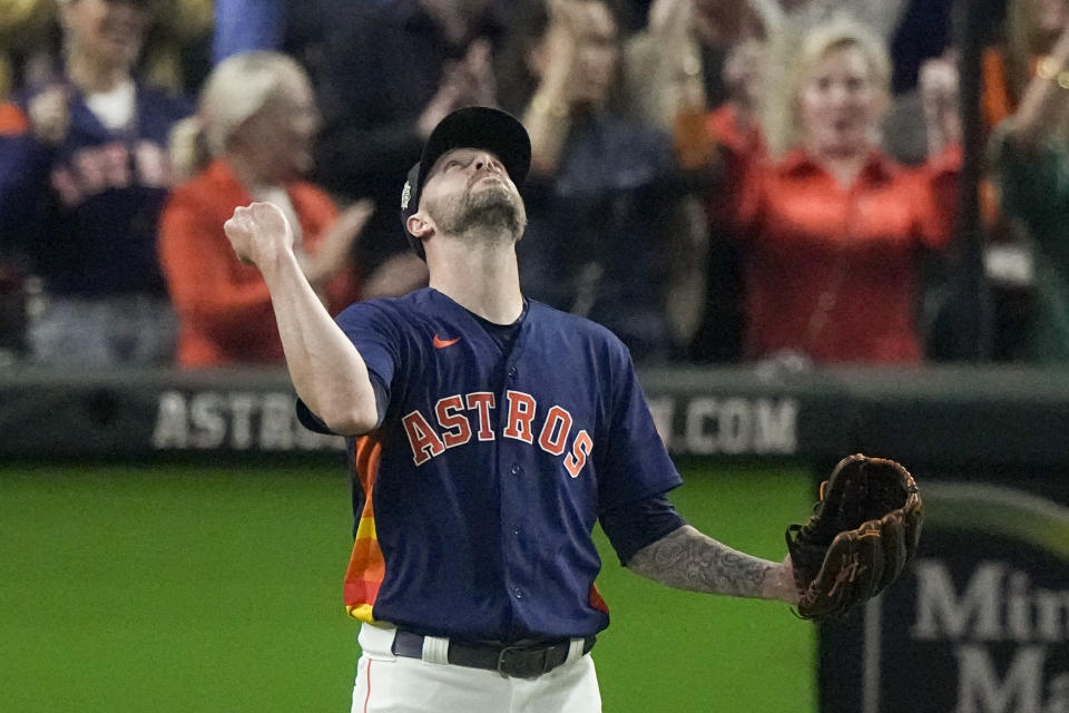 Houston Astros relief pitcher Ryan Pressly celebrates their win in Game 2 of baseball's World Series between the Houston Astros and the Philadelphia Phillies on Saturday, Oct. 29, 2022, in Houston. The Astros won 5-2. (AP Photo/Sue Ogrocki)