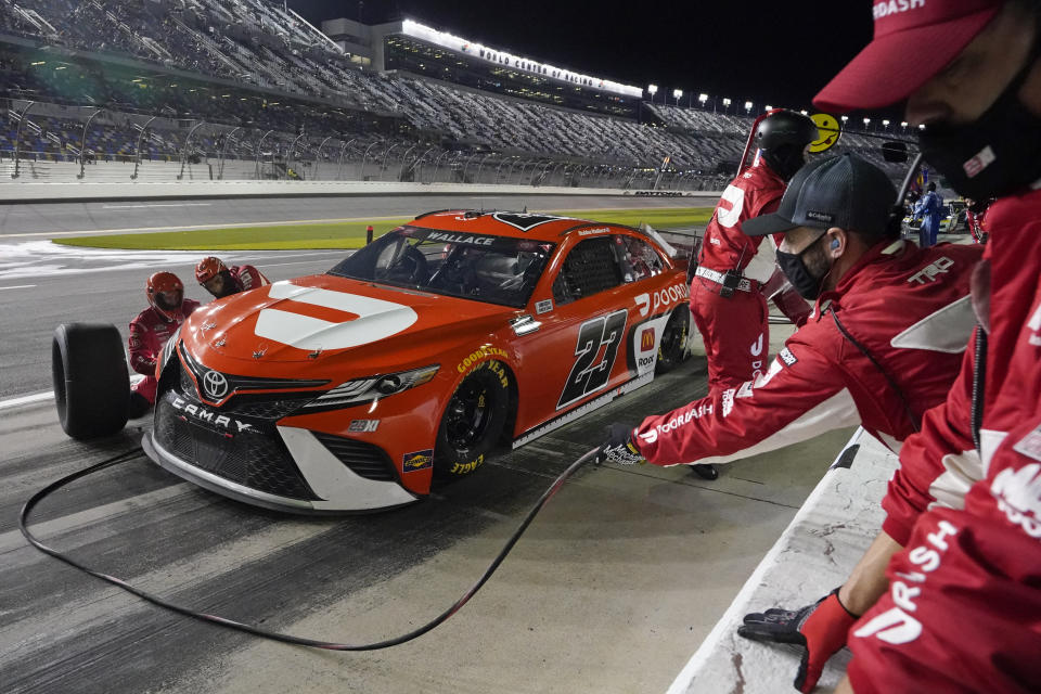 Bubba Wallace makes a pit stop during the second of two qualifying auto races for the NASCAR Daytona 500 at Daytona International Speedway, Thursday, Feb. 11, 2021, in Daytona Beach, Fla. Wallace finished in second place. (AP Photo/John Raoux)