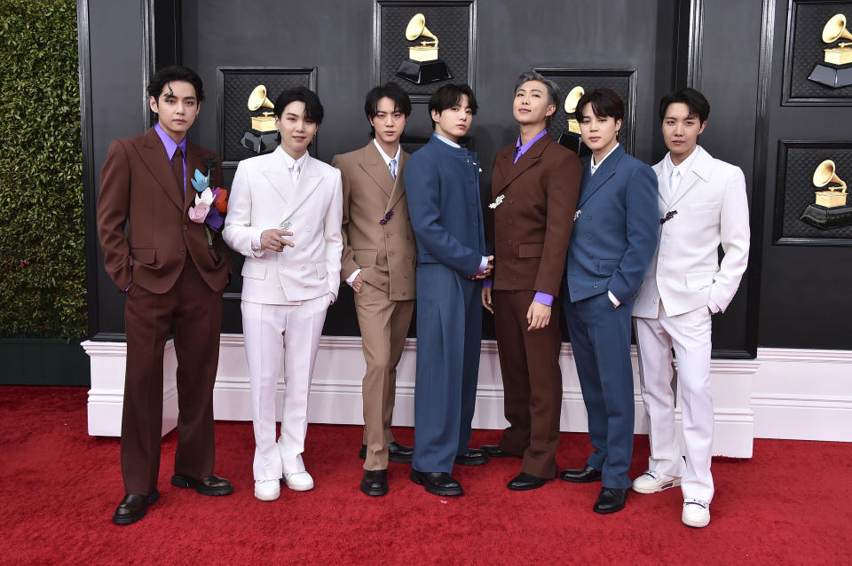 FILE - BTS arrives at the 64th Annual Grammy Awards at the MGM Grand Garden Arena on Sunday, April 3, 2022, in Las Vegas. The surprise announcement by BTS that they were taking a break to focus on members’ solo projects stunned their global fanbase, shaking their label's stock price and leaving many questions about the K-pop supergroup’s future. (Photo by Jordan Strauss/Invision/AP, File)