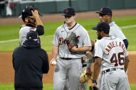 Detroit Tigers manager Ron Gardenhire, front left, comes to the mound to relieve starting pitcher Casey Mize during the sixth inning of a baseball game against the Chicago White Sox, Friday, Sept. 11, 2020, in Chicago. (AP Photo/Charles Rex Arbogast)