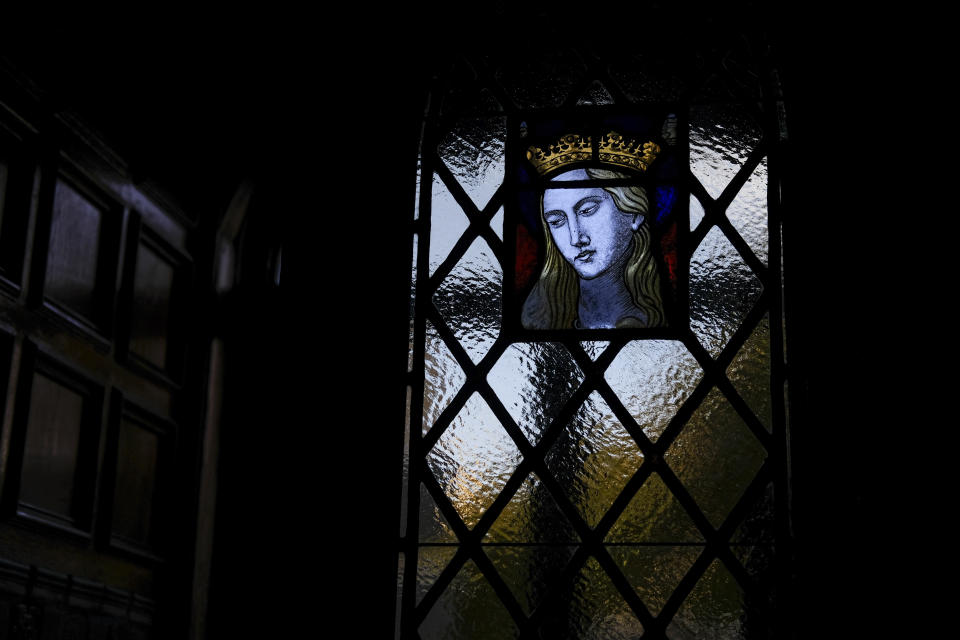 Light illuminates the stained-glass windows of St. Peter the Apostle Catholic Church in Reading, Pa., on Sunday, June 16, 2024. (AP Photo/Luis Andres Henao)