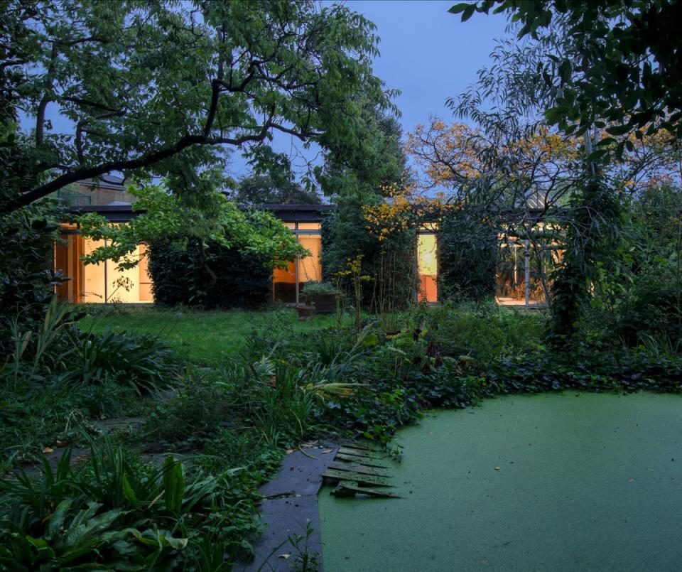 The house also has three courtyard gardens and a pond (Historic England Archive)