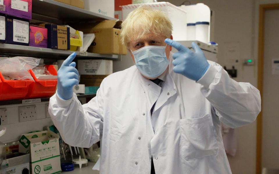 Prime Minister Boris Johnson gestures during a visit to the Jenner Institute in Oxford - Kirsty Wigglesworth/AP