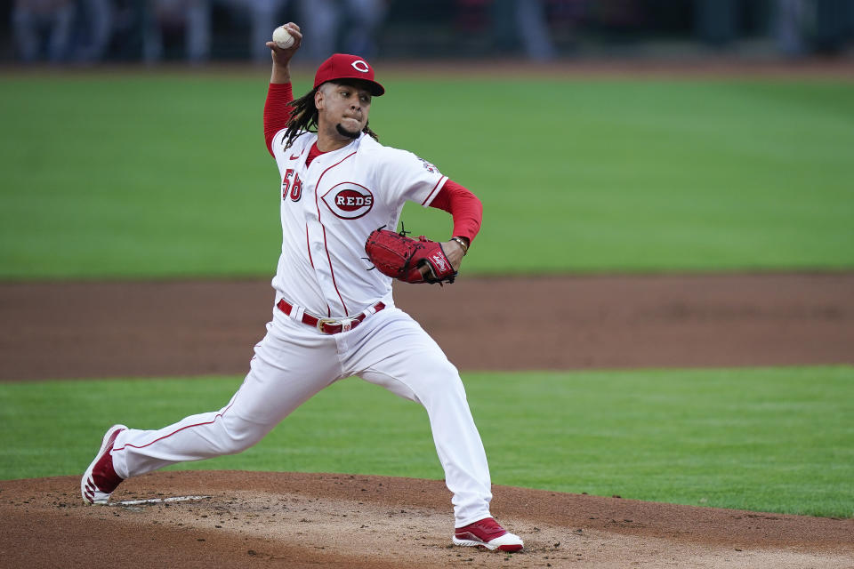 Cincinnati Reds starting pitcher Luis Castillo (58) pitches during the first inning of a baseball game against the Kansas City Royals at Great American Ballpark in Cincinnati, Tuesday, August 11, 2020. (AP Photo/Bryan Woolston)