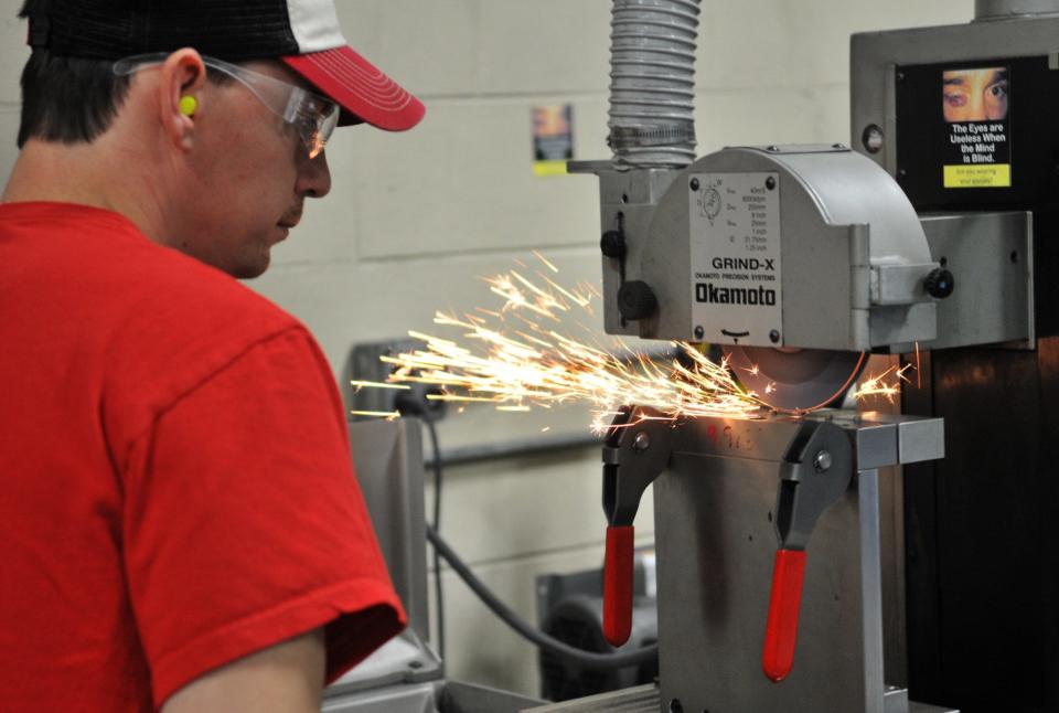 Ricky Parrish works on a gun part at Daniel Defense.