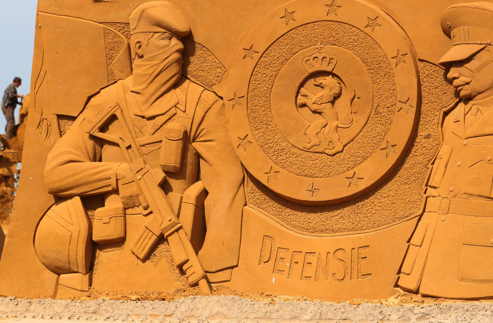 A sand carver works on a sculpture during the Sand Sculpture Festival "Dreams" in Ostend, Belgium June 18, 2019. (Photo: Yves Herman/Reuters)