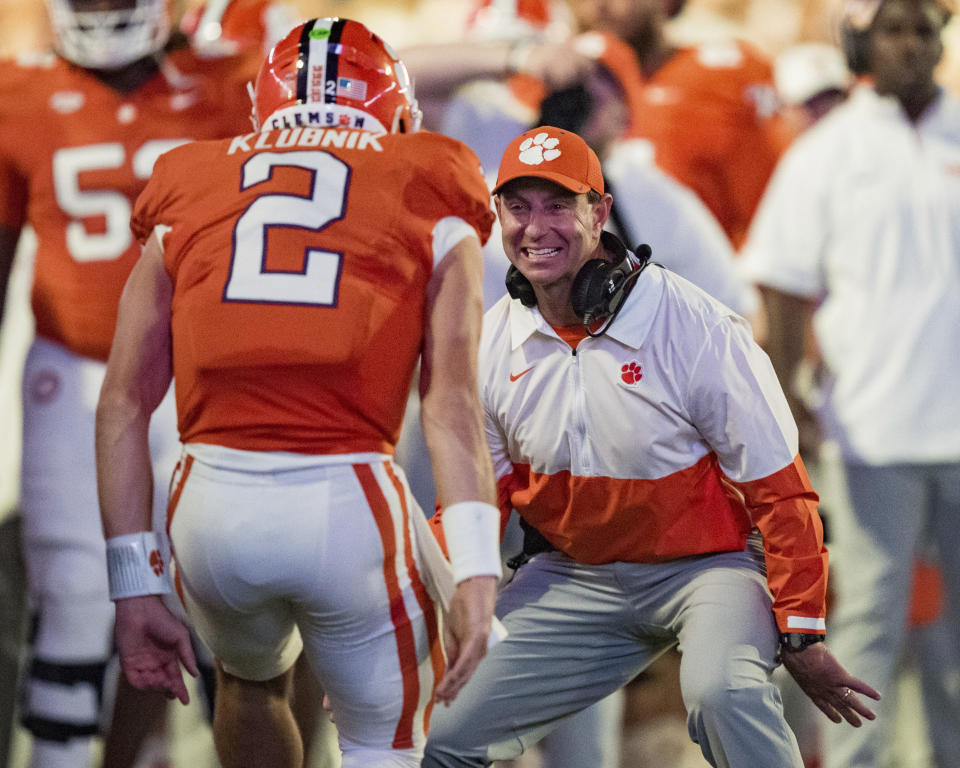 Clemson head coach Dabo Swinney, front right, celebrates with quarterback Cade Klubnik (2) in the first half of an NCAA college football game against Appalachian State, Saturday, Sept. 7, 2024, in Clemson, S.C. (AP Photo/Jacob Kupferman)