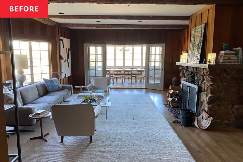 Wood paneled living room before renovation.