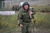 FILE - Recruits carry ammunition during a military training at a firing range in the Rostov-on-Don region in southern Russia, on Oct. 4, 2022. Russian Defense Minister Sergei Shoigu said that the military has recruited over 200,000 reservists as part of a partial mobilization launched two weeks ago. (AP Photo, File)