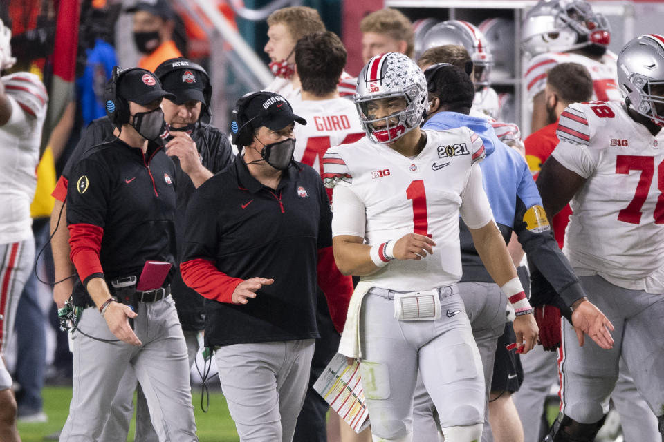 MIAMI GARDENS, FL - JANUARY 11: Ohio State Buckeyes quarterback Justin Fields (1) speaks with Ohio State Buckeyes head coach Ryan Day on the sidelines during the College Football Playoff National Championship football game between the Alabama Crimson Tide and the Ohio State Buckeyes on January 11, 2021 at the Hard Rock Stadium in Miami Gardens, FL. (Photo by Doug Murray/Icon Sportswire via Getty Images)