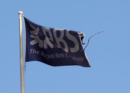 FILE PHOTO: A flag flies above the head office of the Royal Bank of Scotland (RBS) in St Andrew Square in Edinburgh, Scotland, Britain, September 11, 2014. REUTERS/Russell Cheyne/File Photo