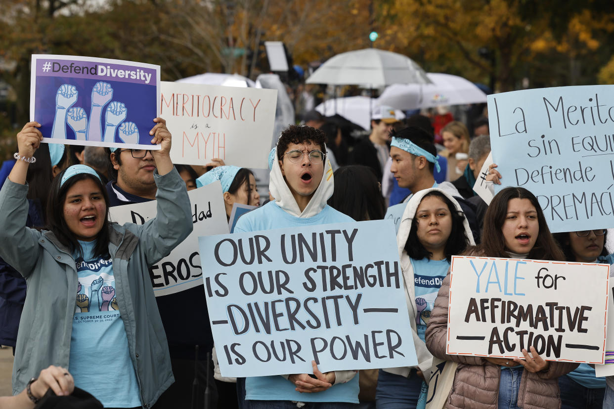 Proponents for affirmative action in higher education at the U.S. Supreme Court in 2022. One person is holding a sign that reads: Our unity is our strength; diversity is our power.