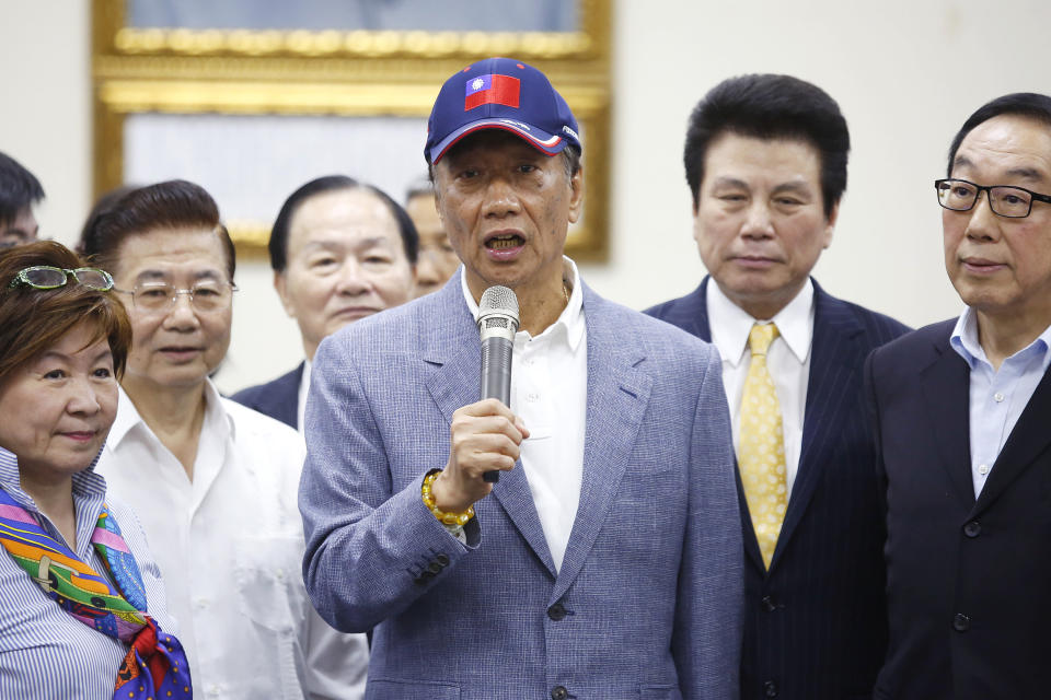 Terry Gou, chairman of Foxconn Technology Group, center, speaks during a media briefing at the Kuomintang party headquarters in Taipei, Taiwan, on Wednesday, April 17, 2019. Gou announced Wednesday he's running for Taiwan's presidency, shaking up a race that will determine whether the island moves closer to China. Photographer: Ashley Pon/Bloomberg via Getty Images