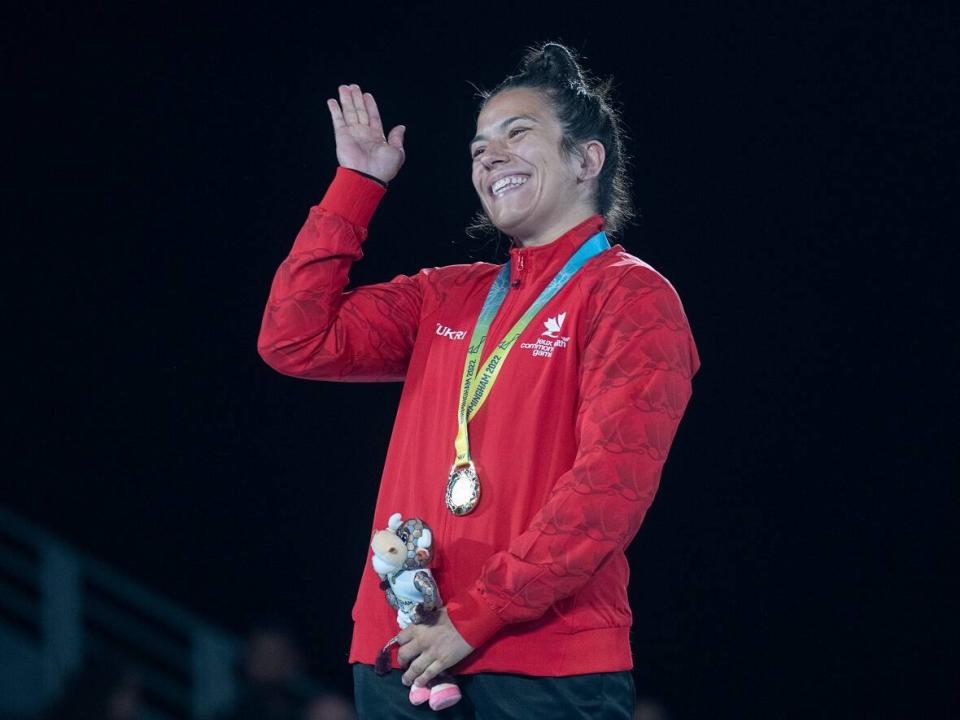 Canada's Justina Di Stasio waves to the crowd after defeating Hannah Amuchechi Rueben from Nigeria in women's 76 kg freestyle wrestling competition at the Commonwealth Games in Coventry, England on Saturday, Aug. 6, 2022.  di Stasio won gold. THE CANADIAN PRESS/Andrew Vaughan (The Canadian Press - image credit)