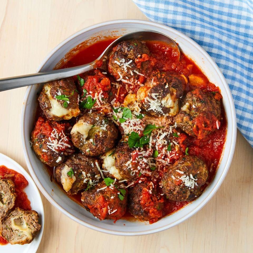 <p>These are stuffed with mozzarella for an extra-fun surprise and once coated in your favourite marinara can be a meal all on their own. These are anything but your ordinary meatball and we are here for it! </p><p>Get the <a href="https://www.delish.com/uk/cooking/recipes/a35761566/air-fryer-meatballs-recipe/" rel="nofollow noopener" target="_blank" data-ylk="slk:Air Fryer Mozzarella-Stuffed Meatballs" class="link rapid-noclick-resp">Air Fryer Mozzarella-Stuffed Meatballs</a> recipe.</p>